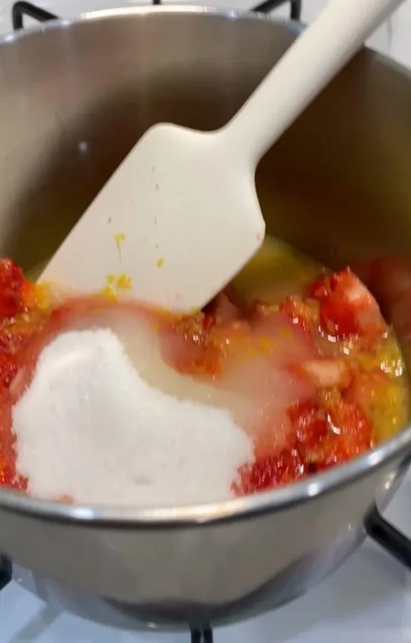 Fresh Strawberries Sugar and Lemon Zest in Saucepan
