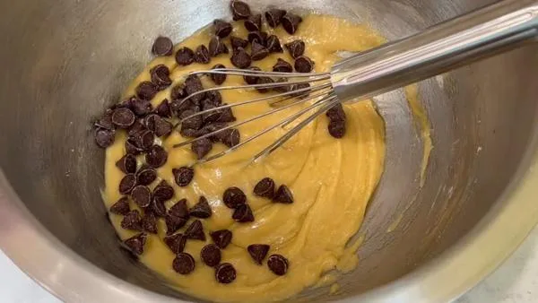 Mini Skillet Cookie Stir Chocolate Chips into the Dough