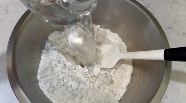 No Knead Dutch Oven Bread Add Water to Flour Mixture