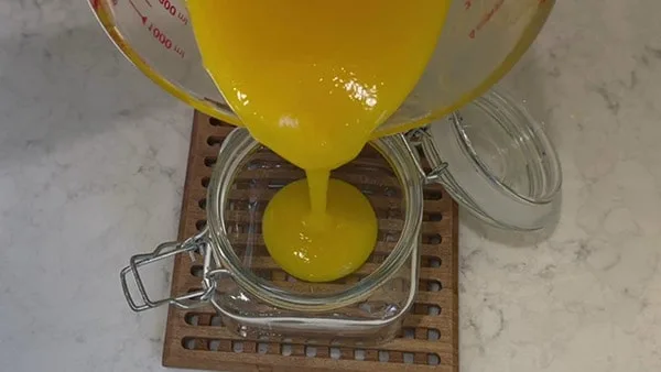 Pour Easy Lemon Curd into Sterilized Jar